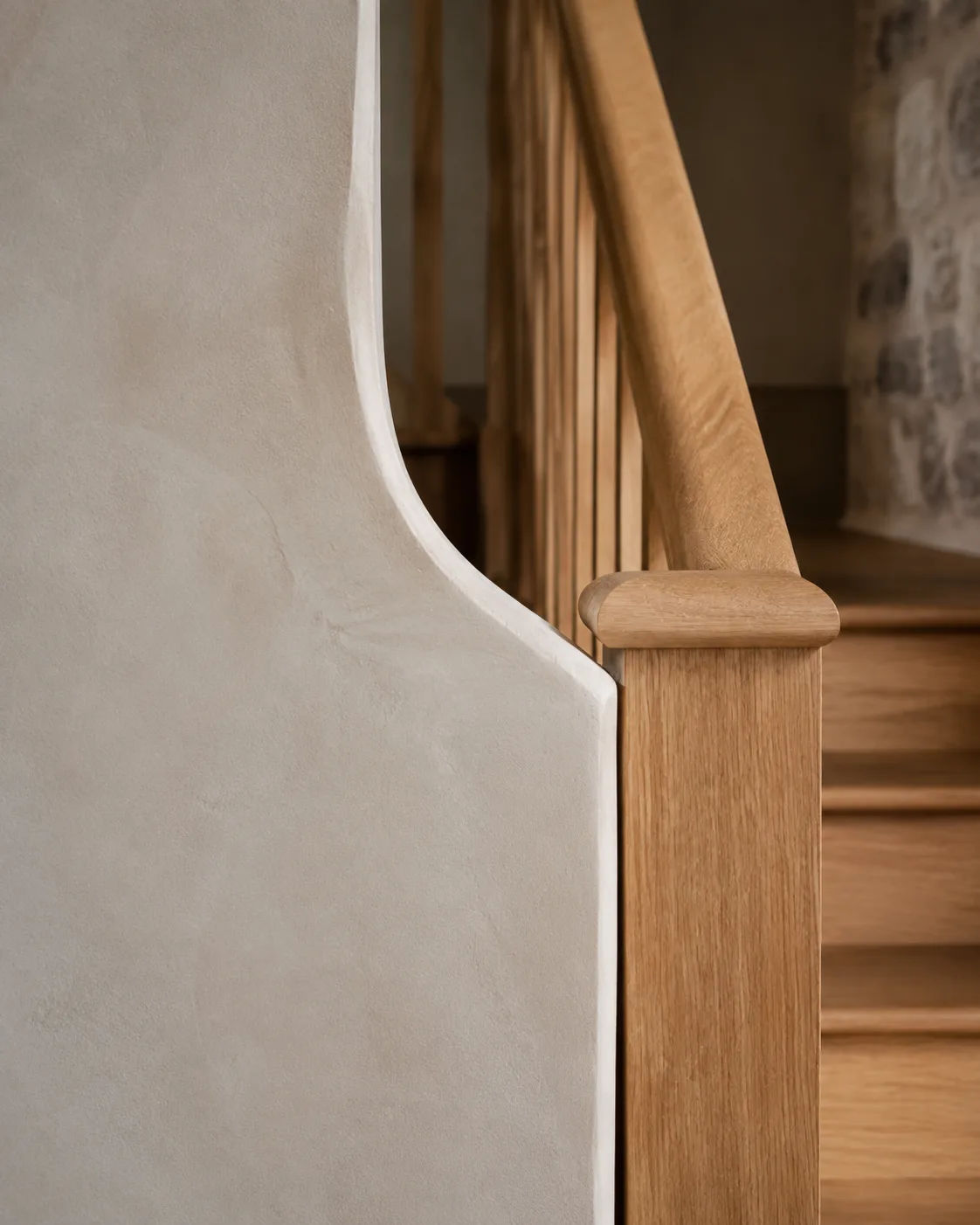 Lime plaster and solid oak stair balustrade detail